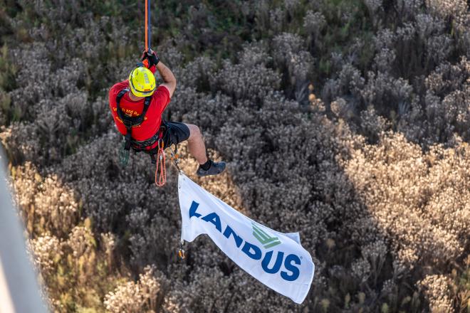 Rescuer hanging under the bridge